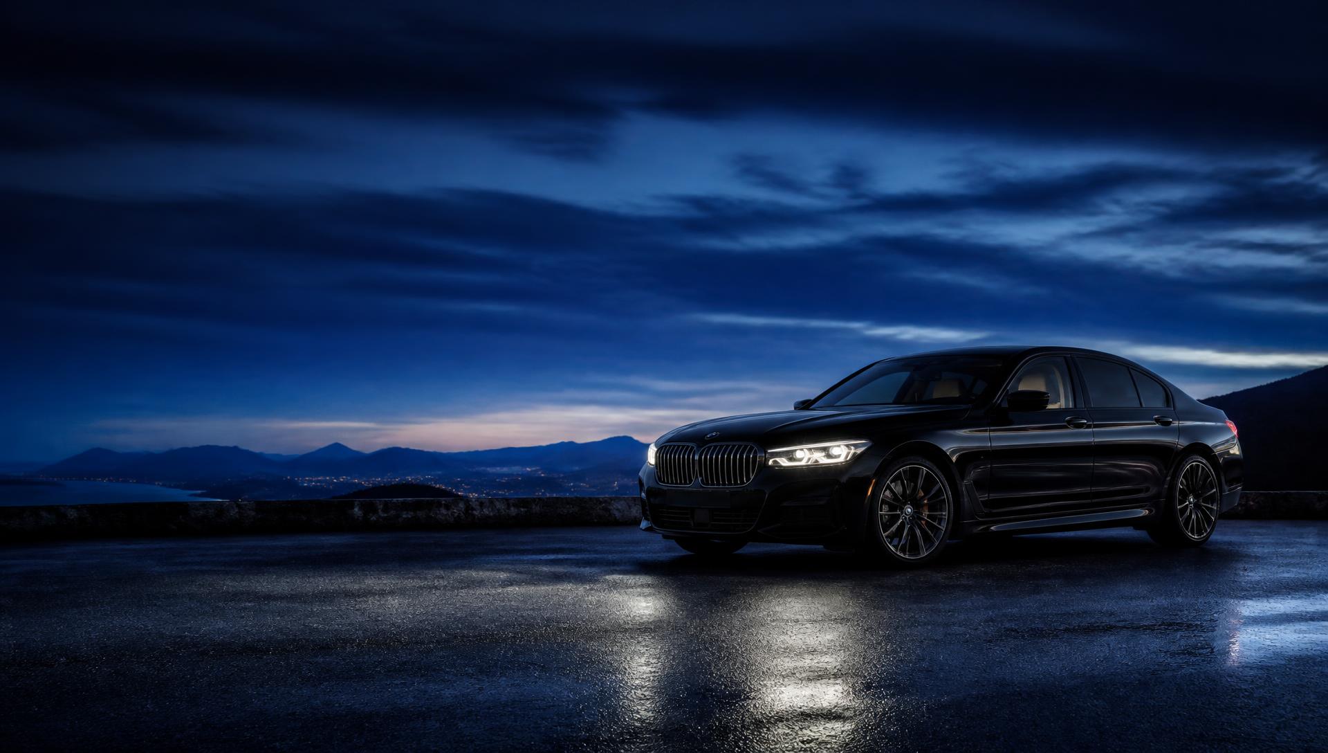 Premium sedan on a wet road at blue hour